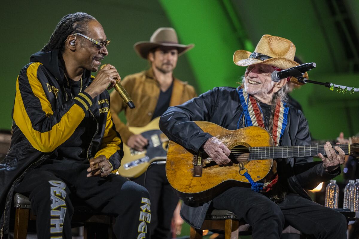 Snoop Dogg and Willie Nelson perform onstage