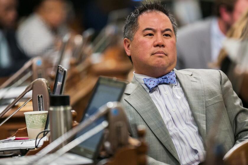 SACRAMENTO, CALIF. -- FRIDAY, SEPTEMBER 11, 2015: Assembly Member Philip Y. Ting listens to fellow lawmakers discuss legislation on the assembly floor, in Sacramento, Calif., on Sept. 11, 2015. (Marcus Yam / Los Angeles Times)