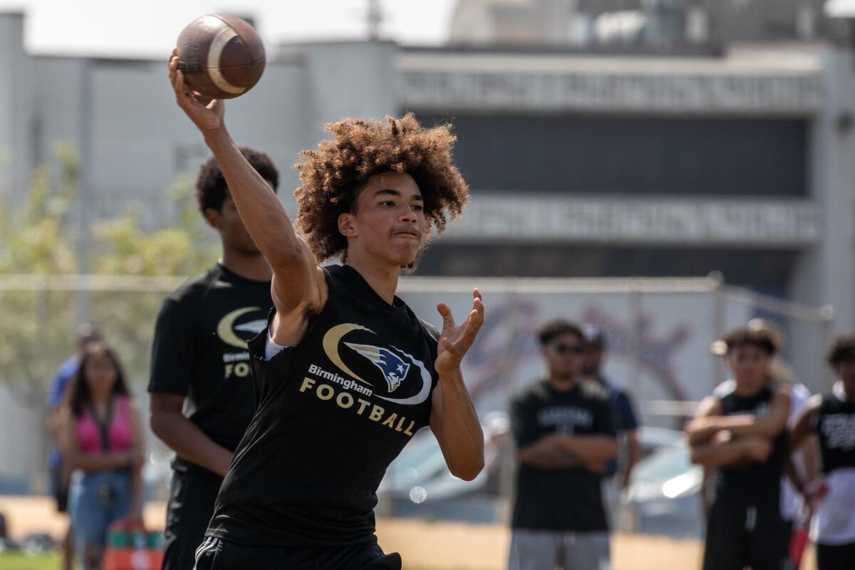 Birmingham quarterback Javen Hall throws during a passing competition at Garfield High on Saturday.