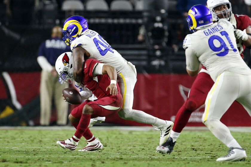 Arizona Cardinals quarterback Kyler Murray, left, is sacked by Los Angeles Rams outside linebacker Von Miller (40) during the second half of an NFL football game Monday, Dec. 13, 2021, in Glendale, Ariz. (AP Photo/Ralph Freso)