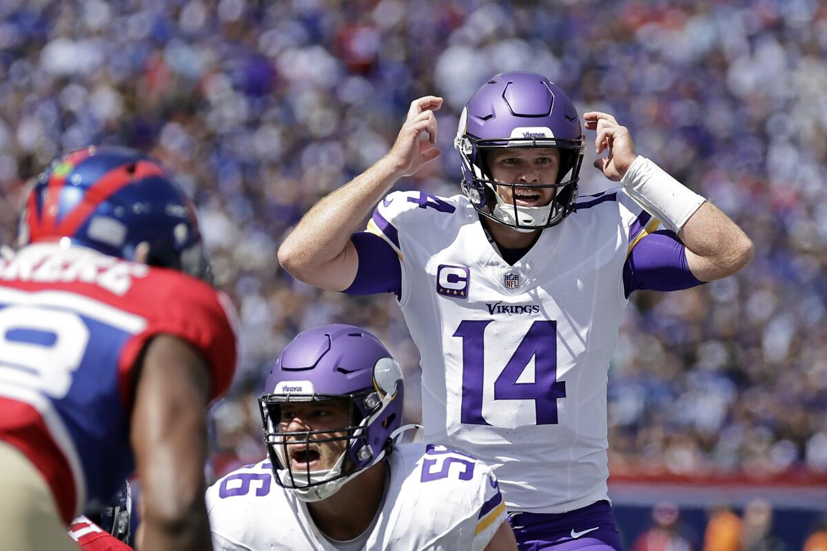 Vikings quarterback Sam Darnold (14) signals at the line Week 1 against the Giants. 