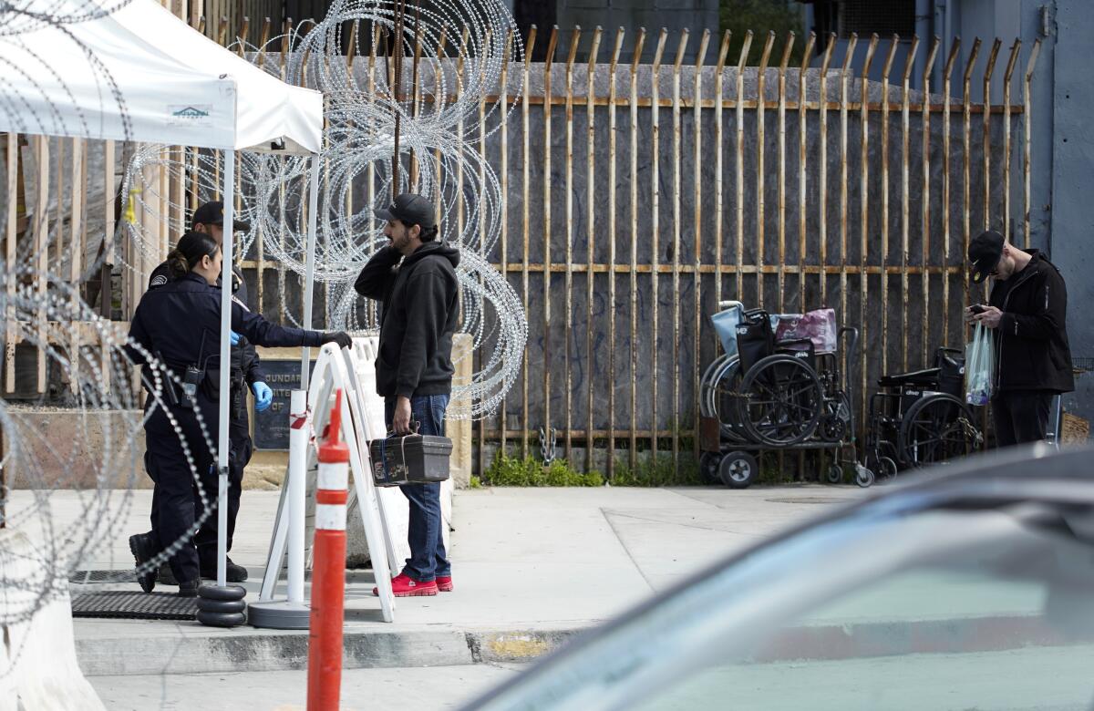 Tijuana, Baja California, Mexico March 20th, 2020 | A man speaks with a U.S. Customs and Border Protection officers before being allowed to cross. At the San Ysidro Pedeast border crossing. | (Alejandro Tamayo, The San Diego Union Tribune 2020)