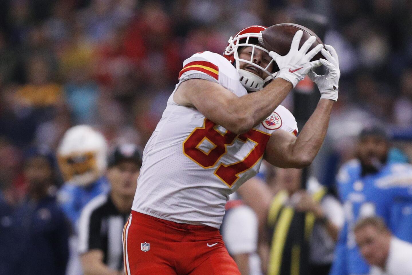 Chiefs tight end Travis Kelce hauls in a pass against his helmet during a game against the Chargers on Nov. 18 in Mexico City.