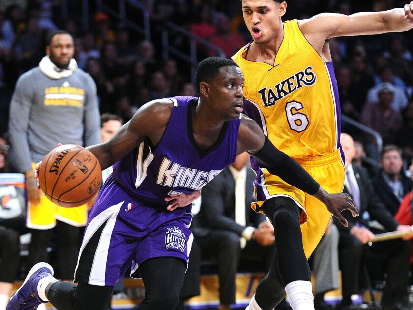 Kings guard Darren Collison drives past Lakers guard Jordan Clarkson during a game March 15 at Staples Center.