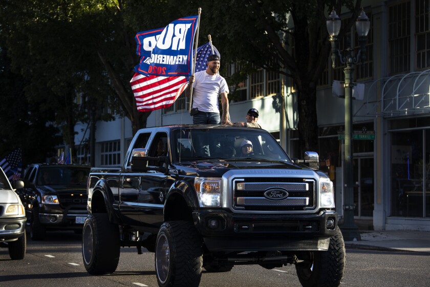 President Trump supporters attend a rally and car parade from Clackamas to Portland, Ore.