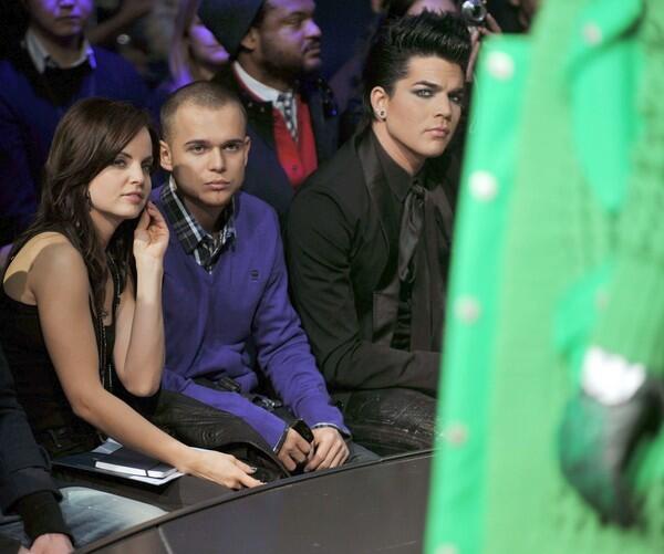 Mena Suvari and boyfriend Simone Sestito, center, watch the G-Star Raw show with "American Idol" finalist Adam Lambert.
