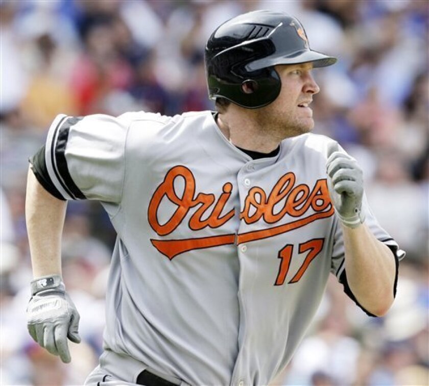 Baltimore Orioles' Aubrey Huff watches his double--his third of the game--fly into deep center field during the fifth inning of a baseball game against the Chicago Cubs at Wrigley Field in Chicago, Thursday, June 26, 2008. (AP Photo/Charles Rex Arbogast)