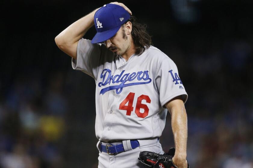 Los Angeles Dodgers starting pitcher Tony Gonsolin pauses on the mound during the first inning of a baseball game against the Arizona Diamondbacks Wednesday, June 26, 2019, in Phoenix. (AP Photo/Ross D. Franklin)