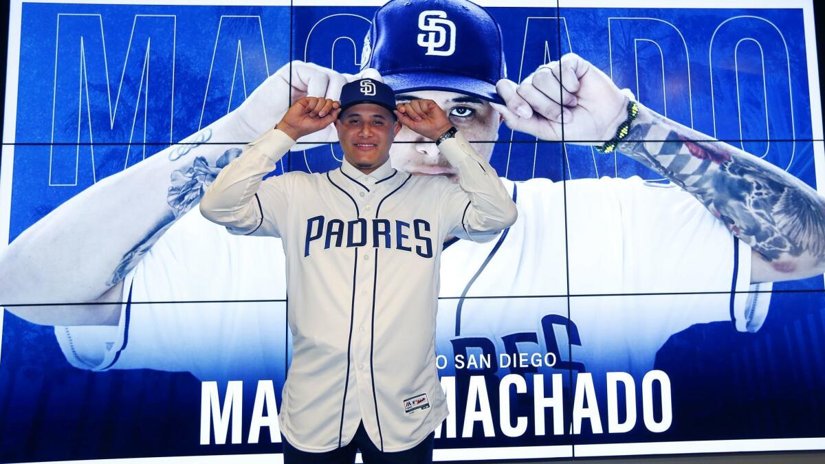 Finally a Padre,' Machado arrives in Arizona - The San Diego Union-Tribune