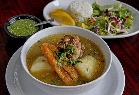 Sancocho de cola, Colombian beef soup with potatoes, cassava and green plantains, and salad.