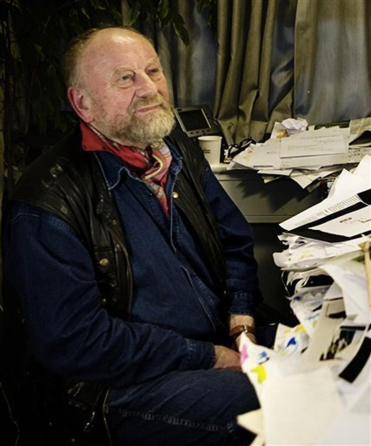 FILE- In this Oct. 27, 2009 file photo, Danish cartoonist Kurt Westergaard, sits in the offices of Danish newspaper Jyllands-Posten in Aarhus, Denmark. Police foiled an attempt to kill an artist who drew cartoons depicting the Prophet Muhammad that sparked outrage in the Muslim world, the head of Denmark's intelligence service said Saturday, Jan. 2, 2010. Jakob Scharf, who heads the PET intelligence service, said a 28-year-old Somalia man was armed with an ax and a knife when he attempted to enter Kurt Westergaard's home in Aarhus shortly after 10 p.m. (2100 GMT) on Friday.(AP Photo/Polfoto) DENMARK OUT