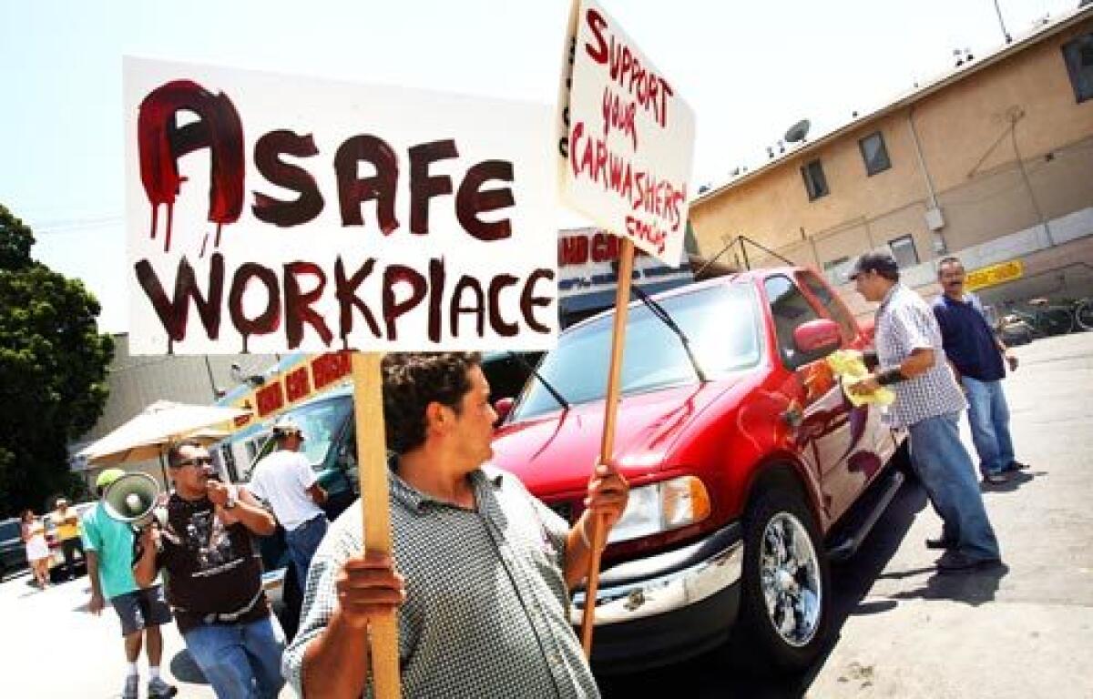 After picketers demonstrated against unfair working conditions at Nary 's carwash on Beverly Boulevard, the owner fired most of them and sold the business.