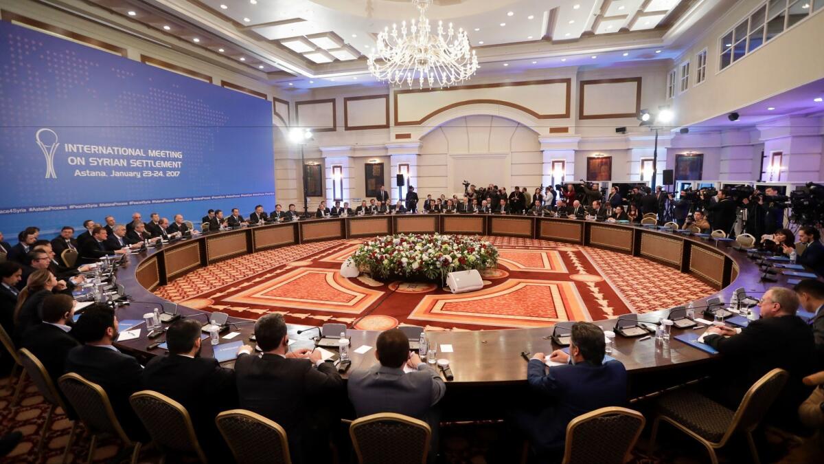 Delegations from Russia, Iran and Turkey hold talks on Syrian peace at a hotel in Astana, Kazakhstan, on Jan. 23, 2017.