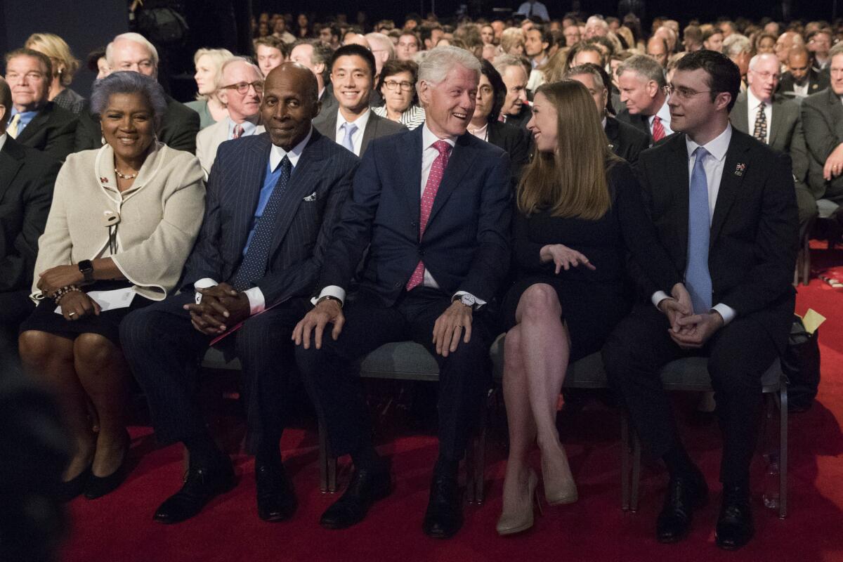 Former President Bill Clinton, along with his daughter Chelsea and Chelsea's husband Marc Mezvinsky and others, waits for the start of the first presidential debate between Hillary Clinton and Donald Trump at Hofstra University on Sept. 26.