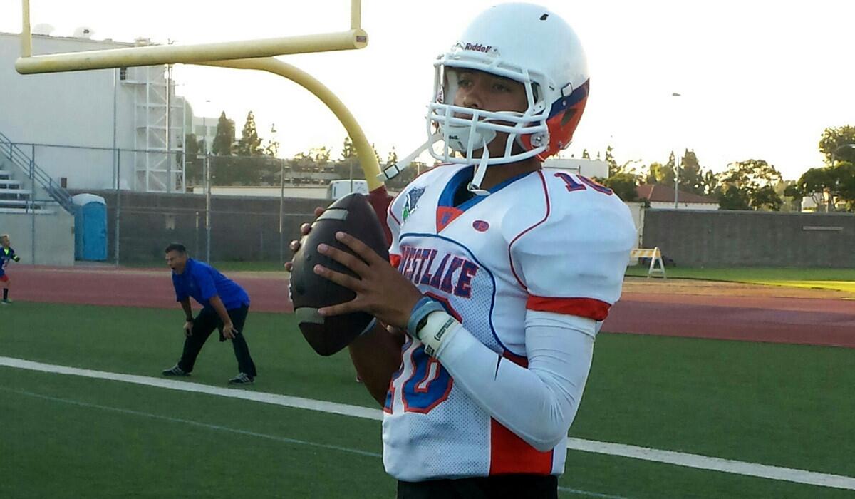 Westlake quarterback Malik Henry prepares to warm up before a game against Long Beach Poly.
