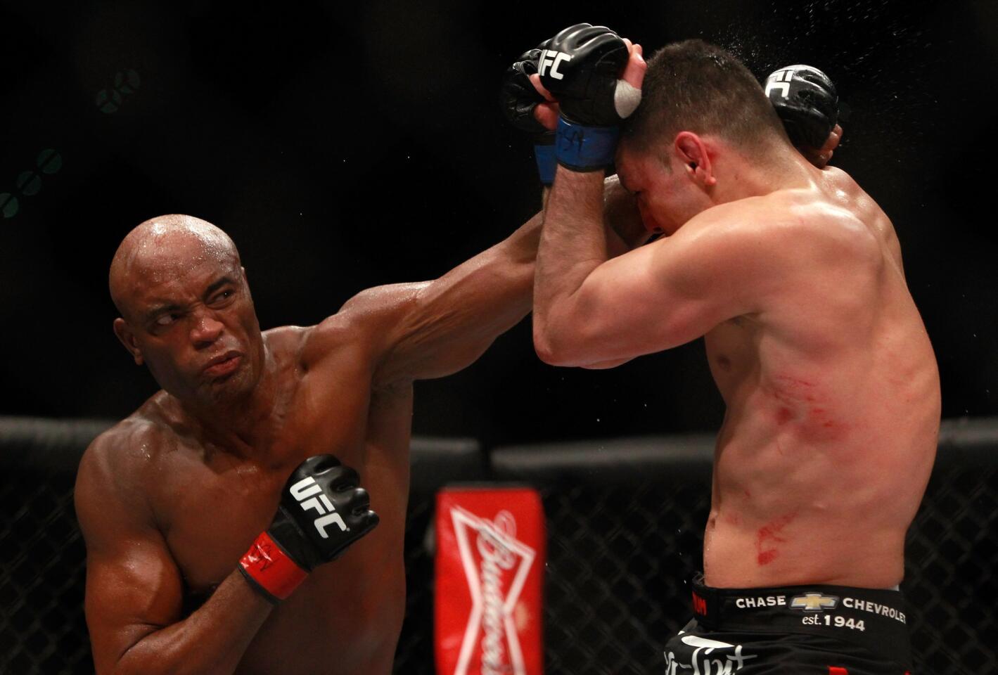 Anderson Silva lands a punch against Nick Diaz during their middleweight fight at UFC 183 on Saturday night at the MGM Grand Garden Arena in Las Vegas.