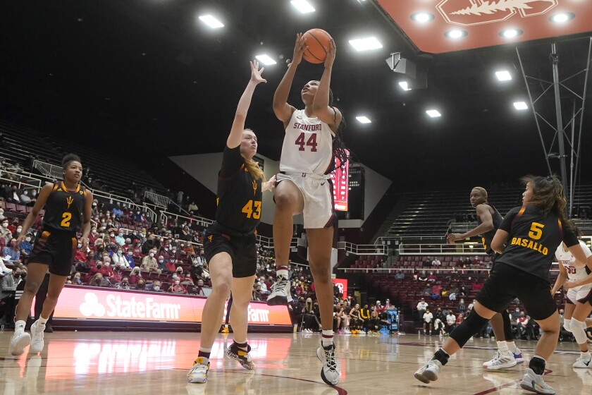 Stanford forward Kiki Iriafen (44) shoots in front of Arizona State center Imogen Greenslade (43) during the second half of an NCAA college basketball game in Stanford, Calif., Friday, Jan. 28, 2022. (AP Photo/Jeff Chiu)
