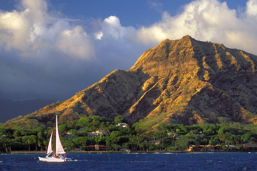 A sailboat heads to the wind with iconic Diamond Head, almost synonymous with Honolulu, as a backdrop. Travelzoo voted Honolulu as the friendliest U.S. City.