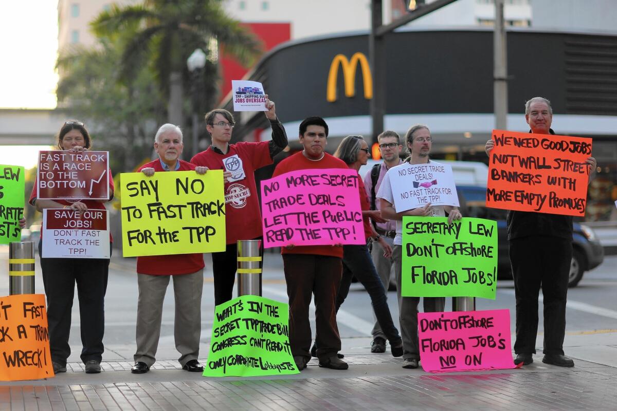 Snowballing numbers of free-speech groups and Internet activists are stepping up their campaign to foil President Obama's Trans-Pacific Partnership trade deal. Above, opponents of the deal protest in Miami last month.