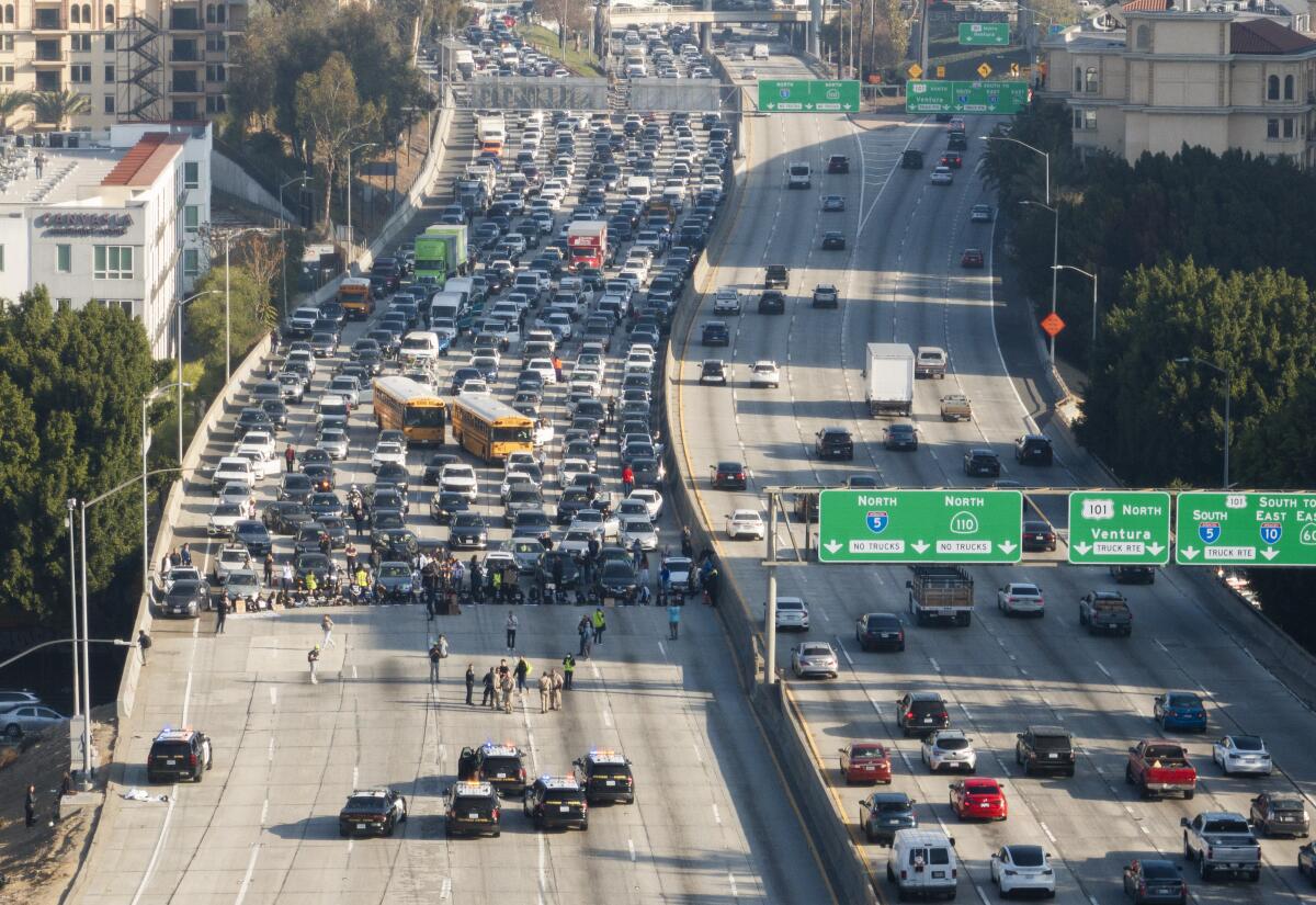 Pro-Palestinian demonstrators block the 110 Freeway traffic in downtown Los Angeles. 