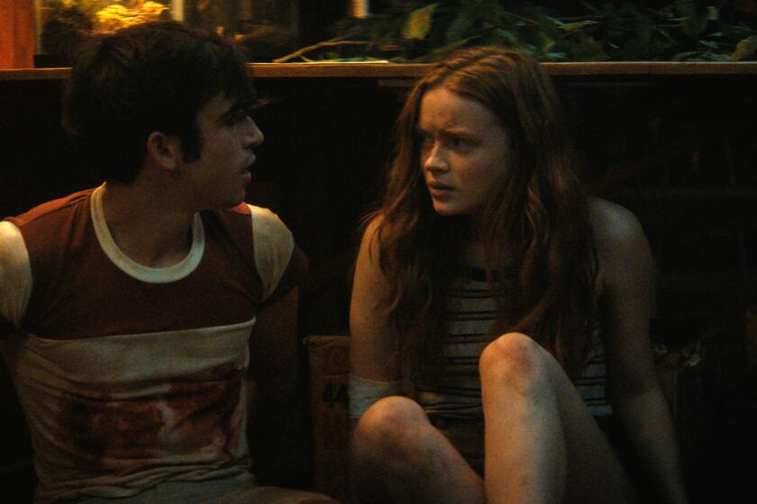 Fear Street Part 2: 1978 - (L-R) TED SUTHERLAND as NICK and SADIE SINK as ZIGGY. Cr: Netflix © 2021