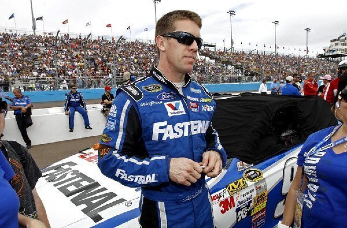 NASCAR driver Carl Edwards waits for the start of the Sprint Cup AdvoCare 500 race on Sunday at Phoenix International Raceway.