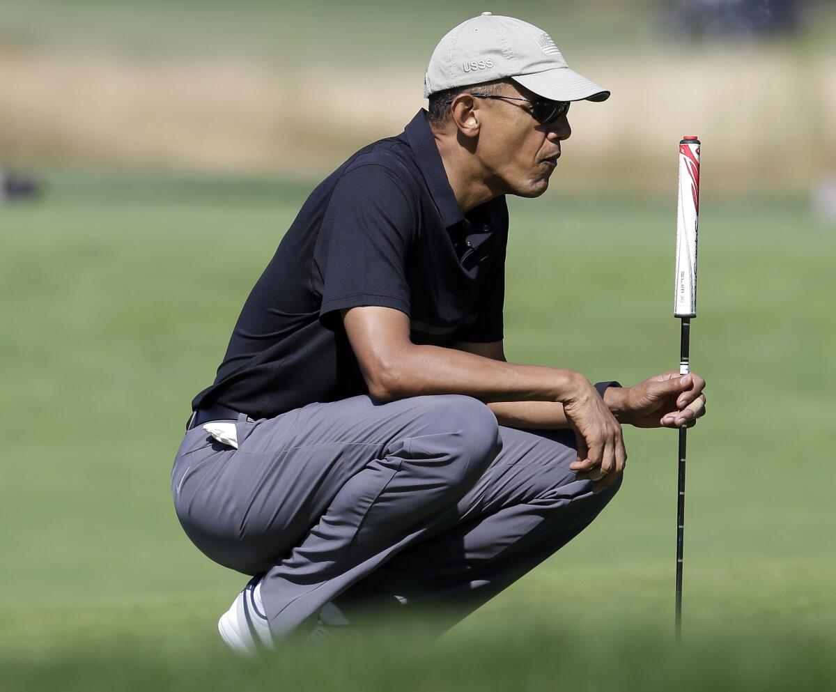 President Obama plays golf Monday at Vineyard Golf Club on Martha's Vineyard.