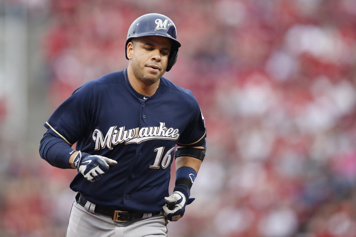 Brewers third baseman Aramis Ramirez rounds the bases after hitting a home run against the Reds.