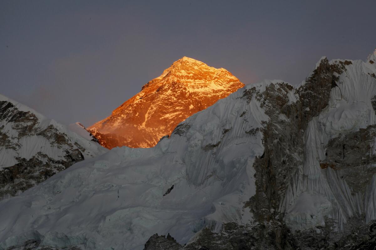 The sun glows on Mt. Everest.