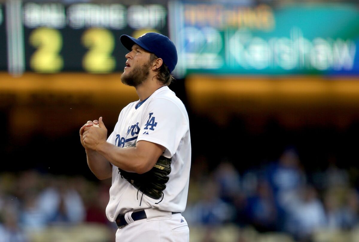Clayton Kershaw prepares to deliver a pitch in the first inning of the Dodgers' 2-1 win Thursday over the San Diego Padres. Kershaw's scoreless inning streak was busted by San Diego's Chase Headley with a home run in the sixth inning.