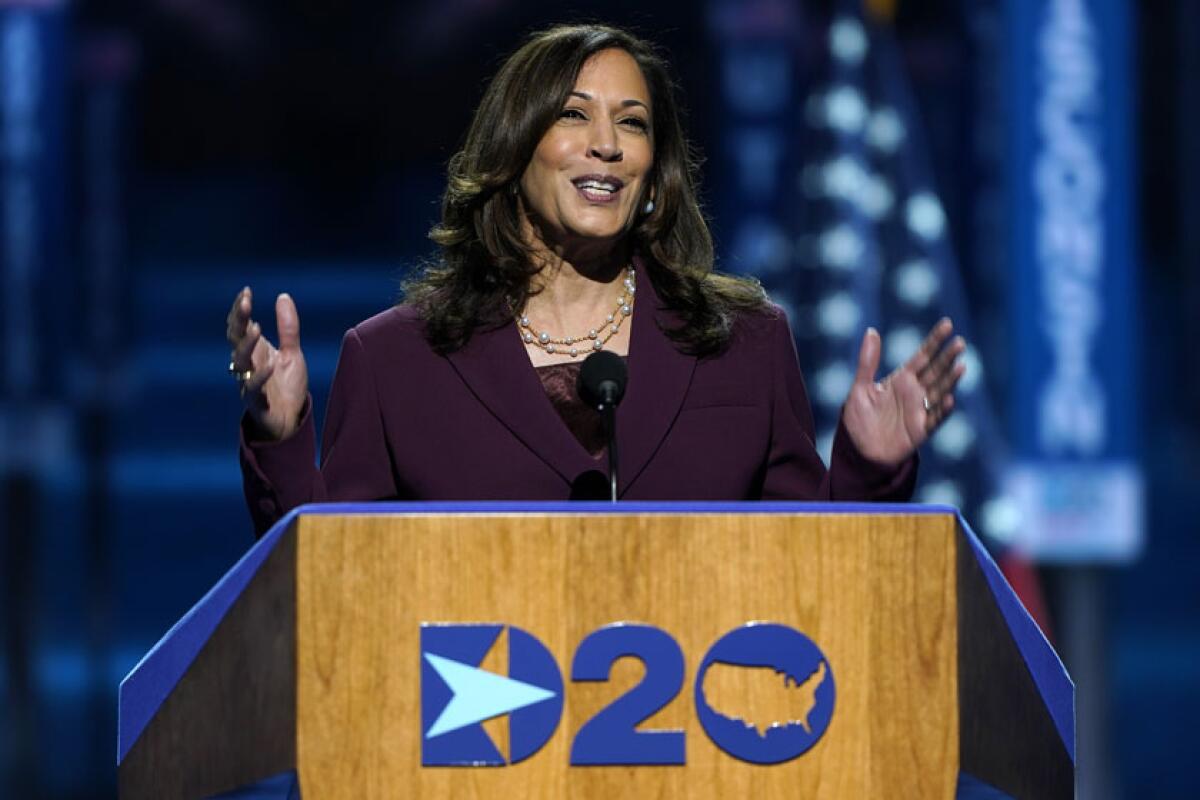 Kamala Harris speaks at a lectern labeled 'D20.'