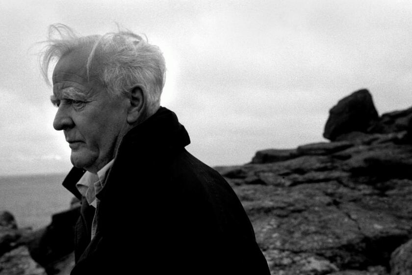 The English writer John Le Carre walking along the Cornish coastline, Cornwall, Great Britain, Nov. 15, 2003. Le Carre, the pen name of David Cornwell, is the author of many bestselling spy novels including The Russia House and A Perfect Spy. (AP Photo/Mandatory Credit: Antonin Kratochvil/VII)