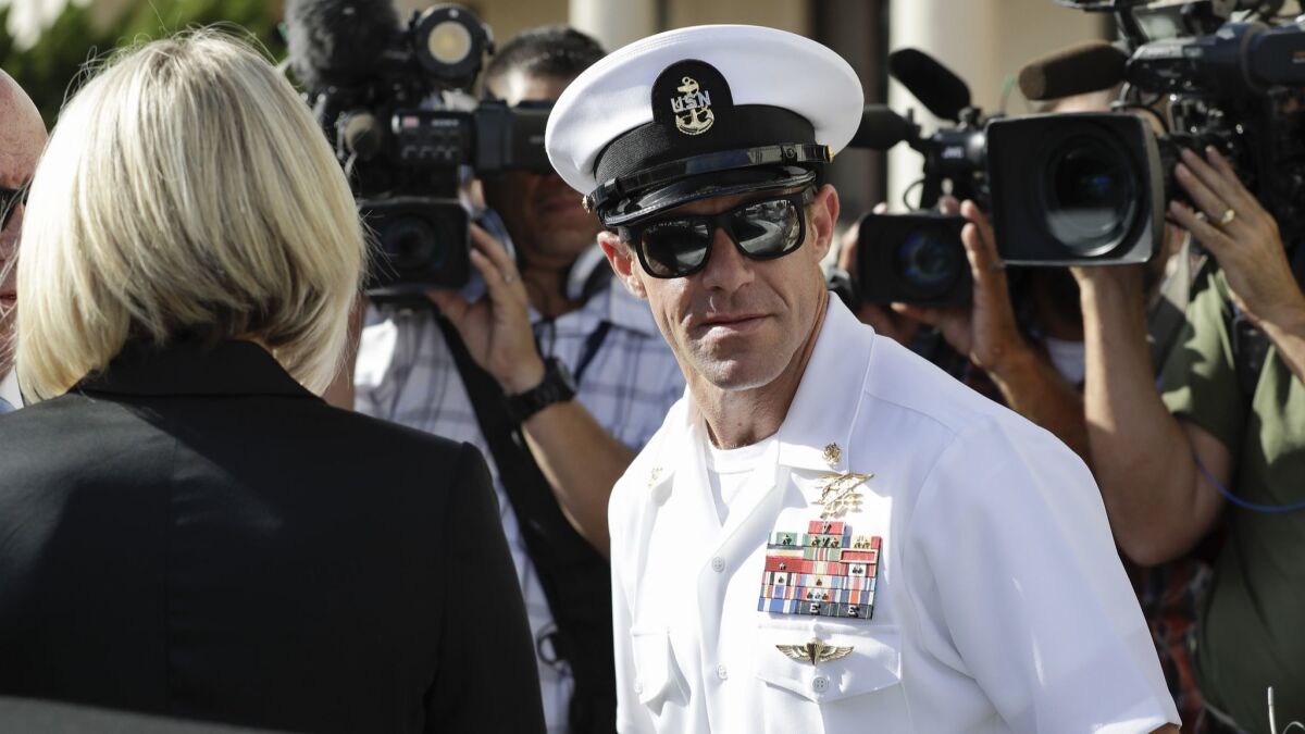 Navy Special Operations Chief Edward Gallagher and his wife, Andrea Gallagher, leave a military court on Naval Base San Diego on Tuesday.