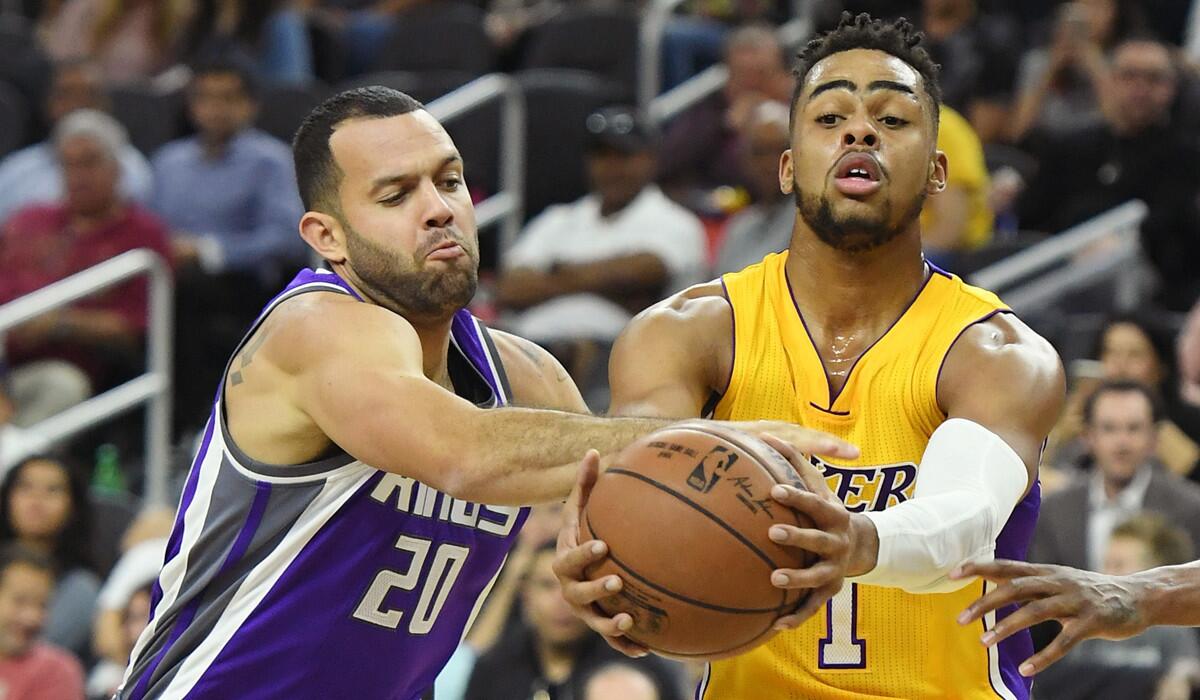 Lakers' D'Angelo Russell, right, is fouled by Sacramento Kings' Jordan Farmar during a preseason game in Las Vegas on Thursday.