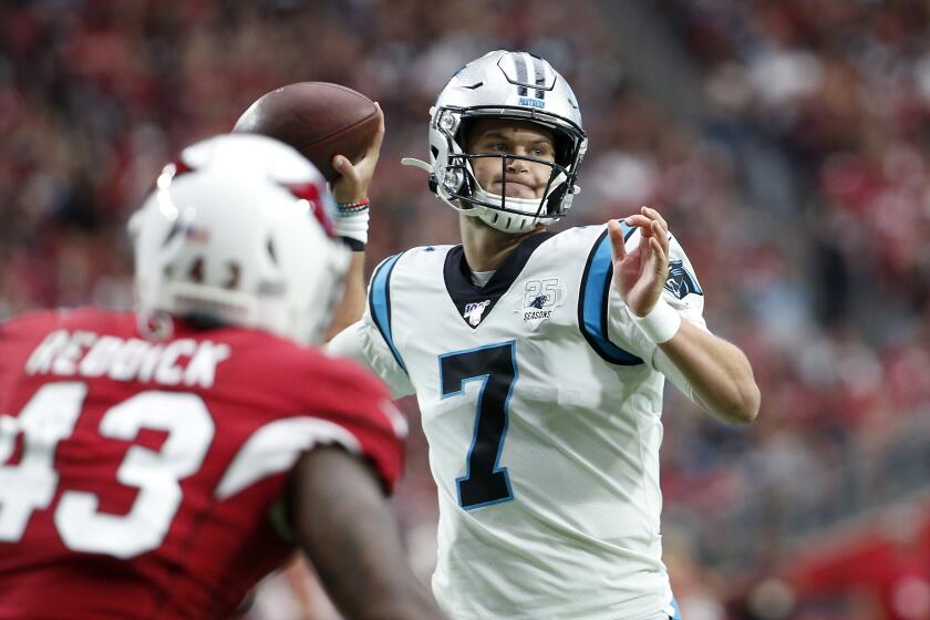 GLENDALE, ARIZONA - SEPTEMBER 22: Quarterback Kyle Allen #7 of the Carolina Panthers throws a touchdown pass to Greg Olsen #88 of the Panthers (not pictured) during the first half of the NFL football game against the Arizona Cardinals at State Farm Stadium on September 22, 2019 in Glendale, Arizona. (Photo by Ralph Freso/Getty Images)