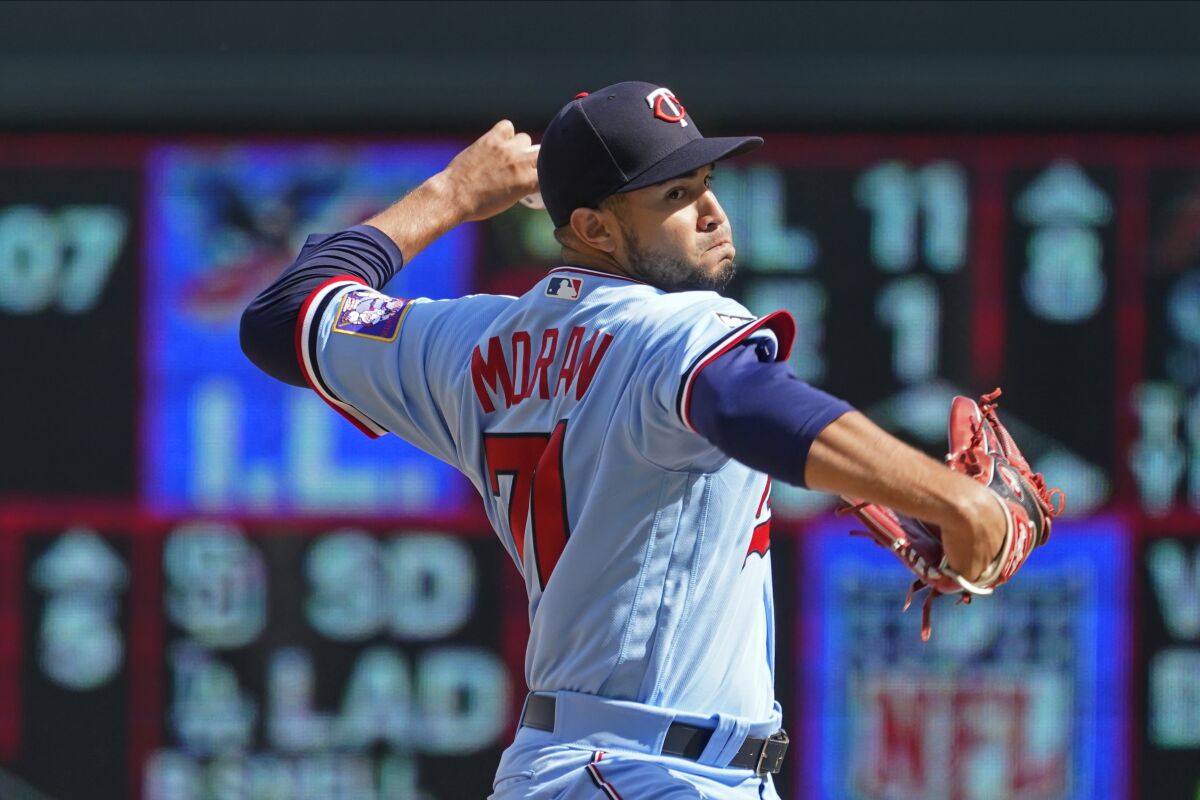 Minnesota Twins pitcher Jovani Moran makes his major league debut as he throws against the Kansas City Royals in the fifth inning of a baseball game, Sunday, Sept. 12, 2021, in Minneapolis. (AP Photo/Jim Mone)