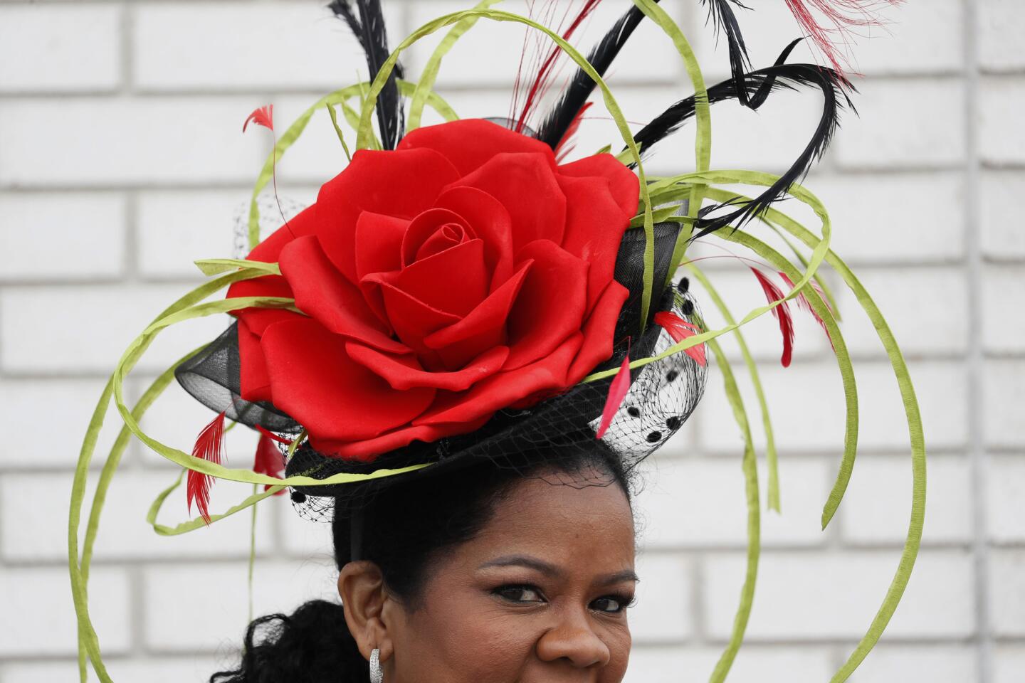 A woman wears a hat during the 145th running of the Kentucky Derby horse race at Churchill Downs on May 4, 2019.