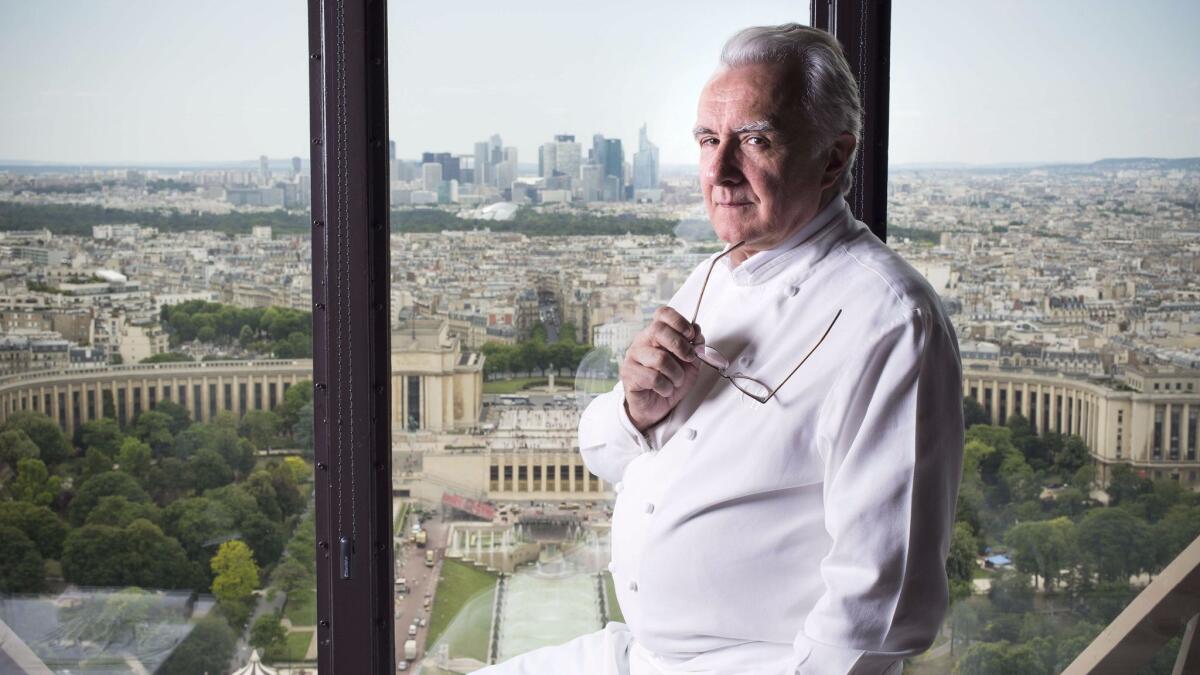 Chef Alain Ducasse poses in his restaurant Le Jules Verne at the Eiffel Tower in Paris on June 23, 2014.