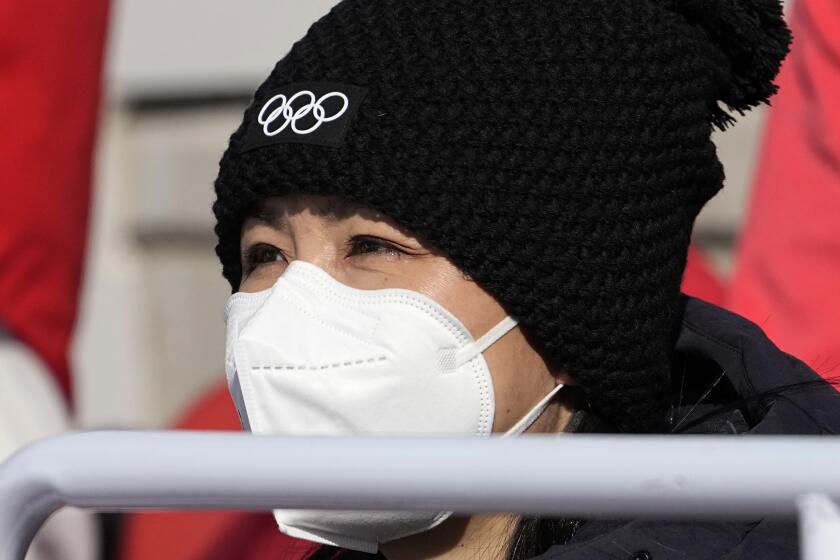 China's Peng Shuai watches the women's freestyle skiing big air finals at the 2022 Winter Olympics, Tuesday, Feb. 8, 2022, in Beijing. (AP Photo/Jae C. Hong)