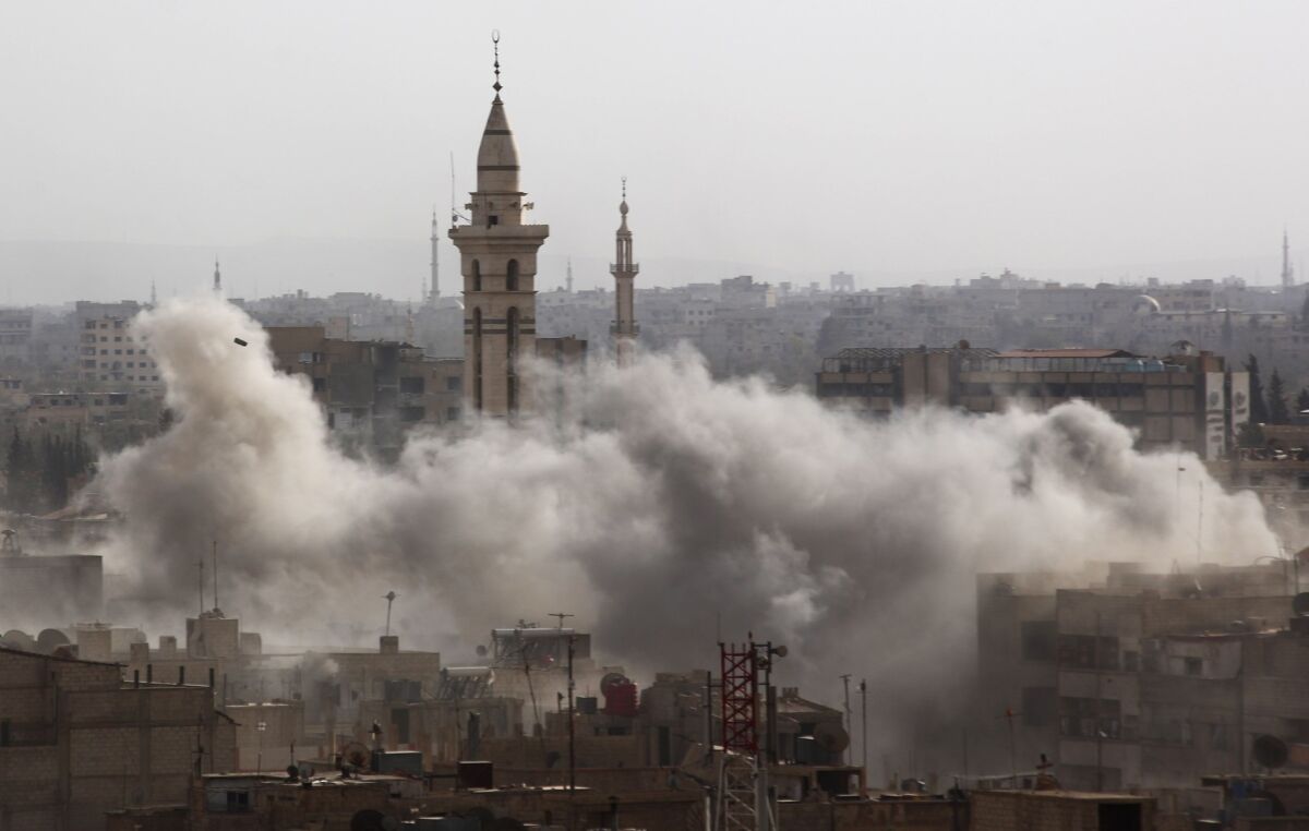 Smoke billows from the rebel-held area of Duma, northeast of the Syrian capital, Damascus, after a reported airstrike by government forces on Sept. 16.