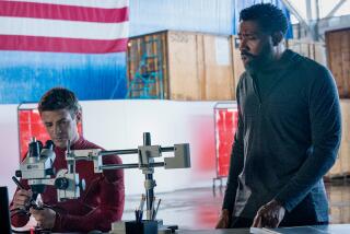 Grant Gustin, left, and Cress Williams in "The Flash" on The CW.