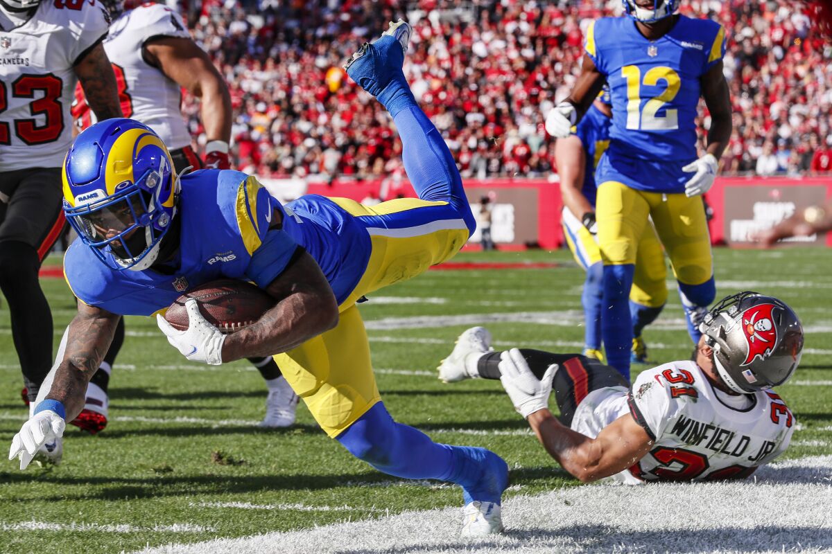 Rams running back Cam Akers is knocked out of bounds against the Buccaneers.