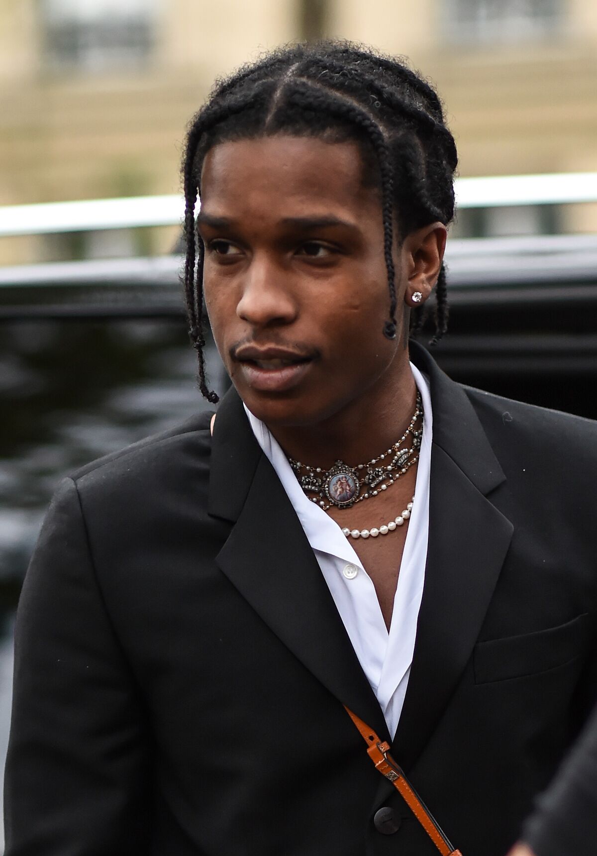 ASAP Rocky wearing pearl necklaces.