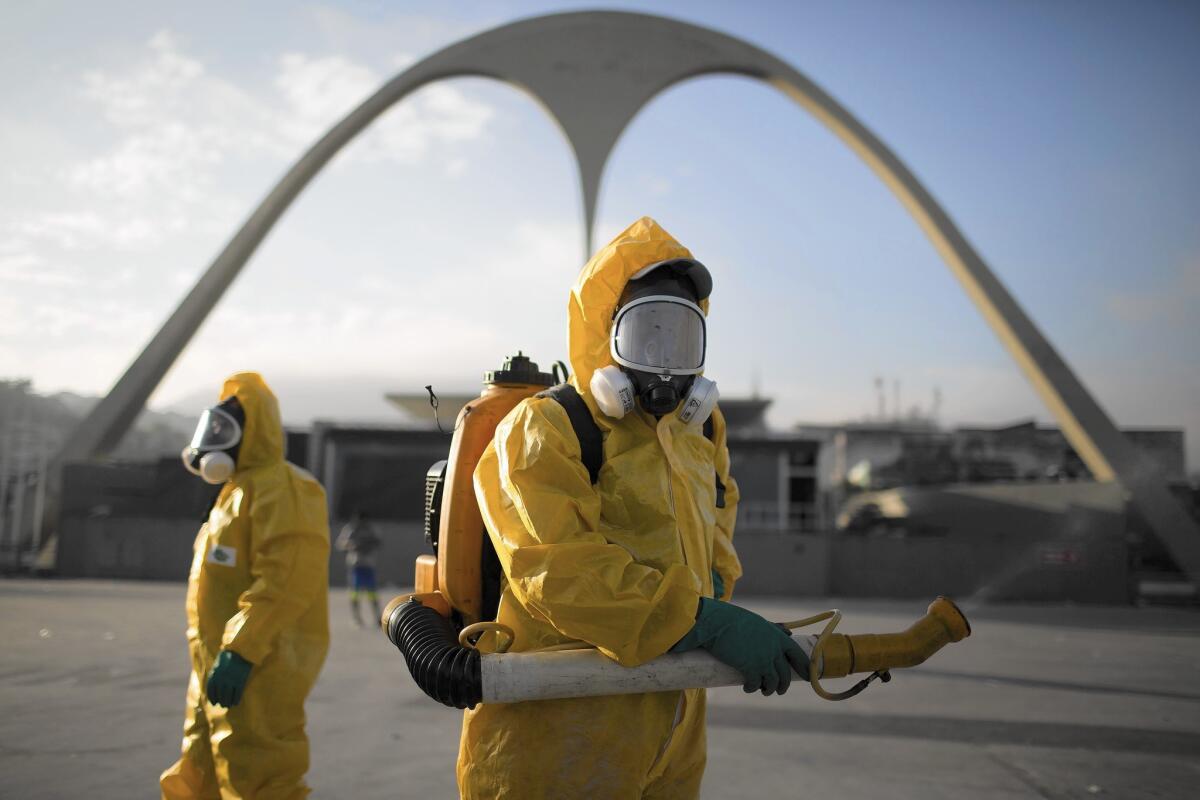 Health workers spray insecticide at Rio de Janeiro's Sambadrome to kill mosquitoes that carry the Zika virus.