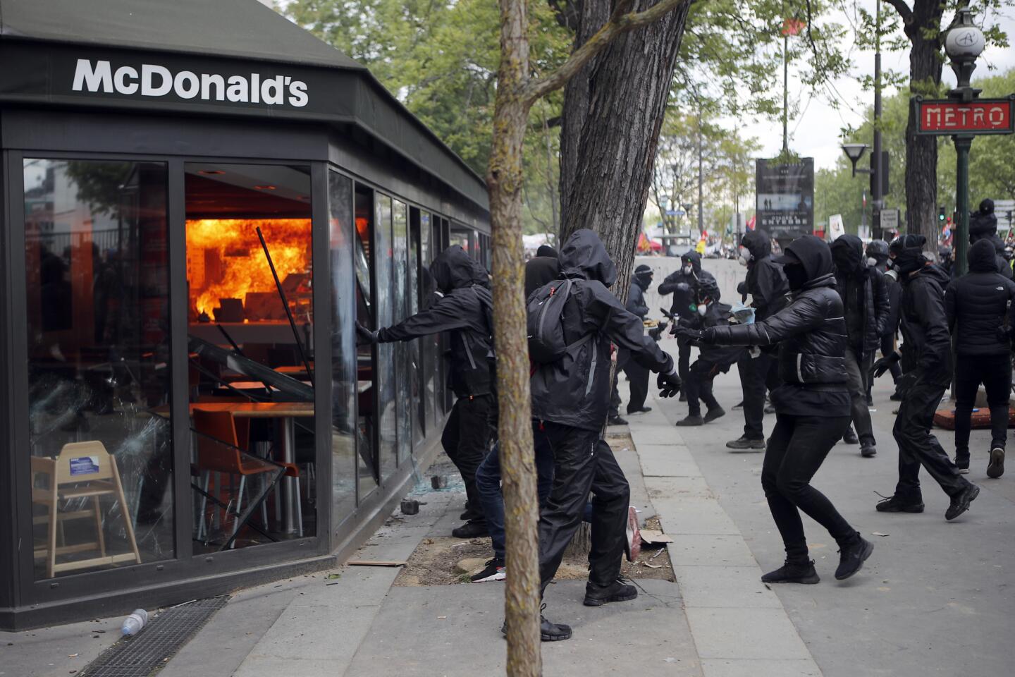 A McDonald's restaurant is hit with petrol bombs thrown by activists Tuesday during the annual May Day rally in the center of Paris.