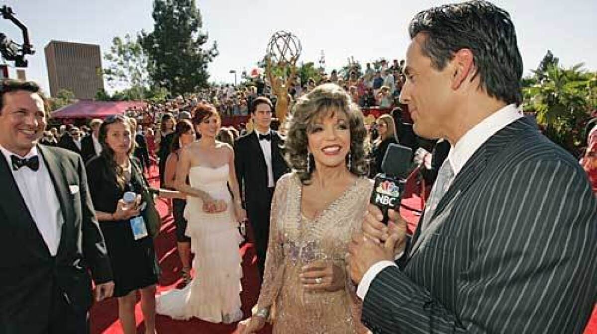 Tony Potts interviews Joan Collins at the 58th annual Primetime Emmy Awards.