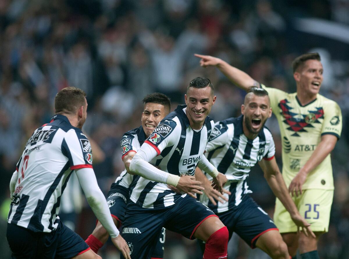 Monterrey's Rogelio Funes Mori (C) celebrates withe teammates after scoring against America during the Mexican Apertura 2019 tournament first leg final football, match at the BBVA Bancomer stadium in Monterrey, Mexico, on December 26, 2019. (Photo by Julio Cesar AGUILAR / AFP) (Photo by JULIO CESAR AGUILAR/AFP via Getty Images) ** OUTS - ELSENT, FPG, CM - OUTS * NM, PH, VA if sourced by CT, LA or MoD **