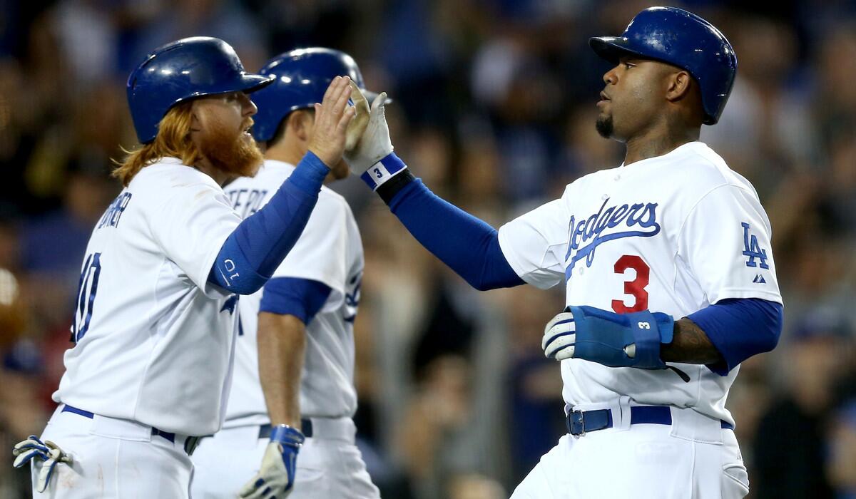 Reserve infielder Justin Turner, left, and left fielder Carl Crawford have been carrying hot bats lately for the the Dodgers.