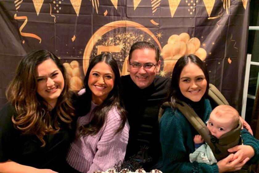 Luis Tovar is surrounded by his three daughters, Genevieve Raygoza, Thalia Tovar and Vania Tovar.  