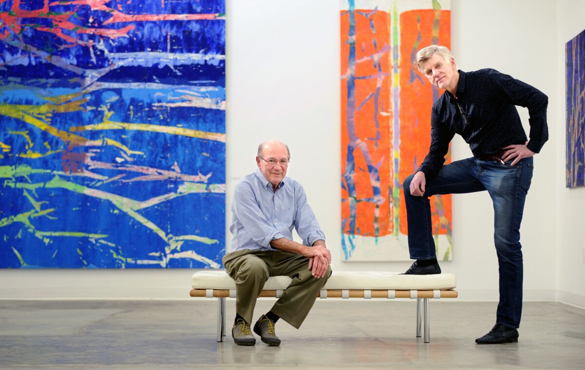 Pedro Cuatrecasas, left, contacted Peter Hastings Falk after finding the paintings of his brother Gil Cuatrecasas. The works are at CB1-G gallery in downtown Los Angeles.